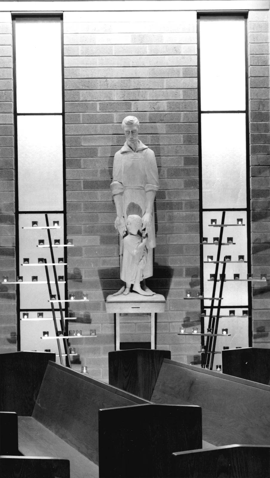 Carved statue of St. Joseph holding the Child Jesus at St. Raymond, 1959.