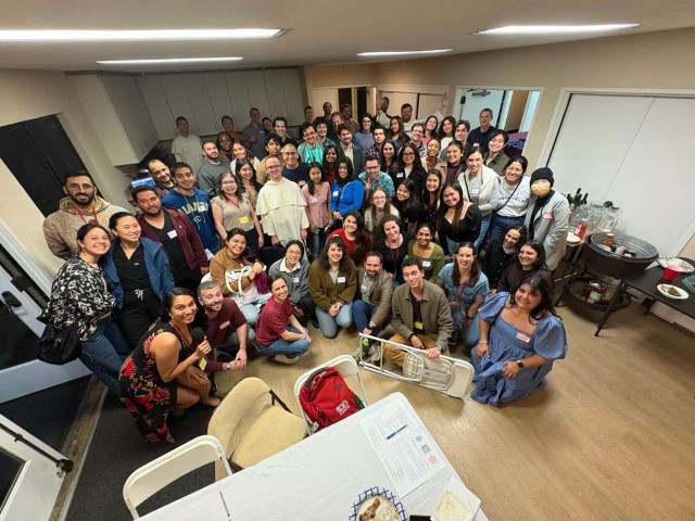 Young adults gathered with a Dominican friar at a 4D evening.